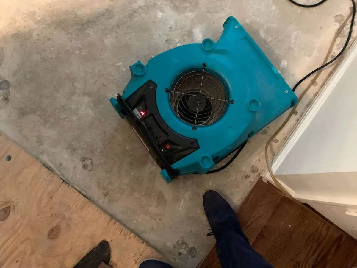 Air mover drying subfloor during Leak Detection & Repair in Riverside
